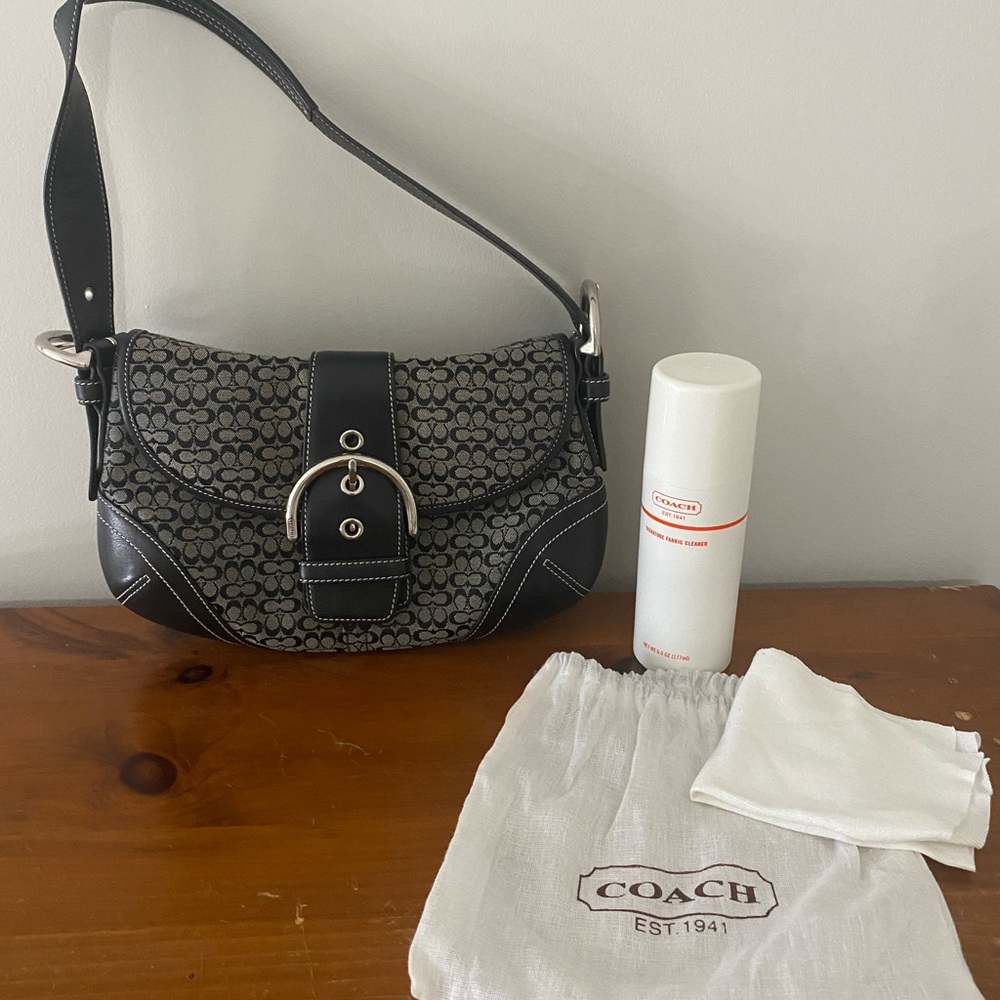 Coach shoulder bag with cleaning solution